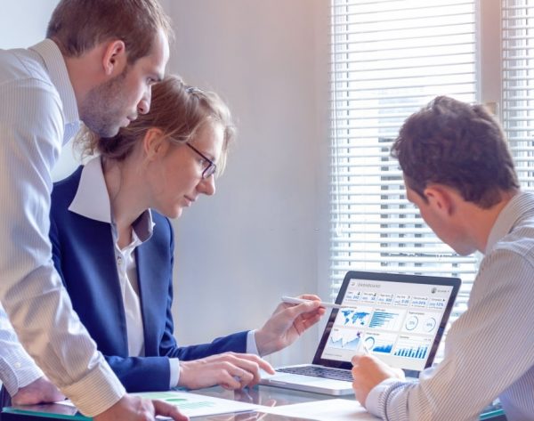 Digital marketing analyst people working on internet advertisement campaign analytics data on key performance indicator dashboard, metrics and KPI on computer screen, business strategy, investment